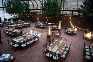 Tables and chairs set up for a wedding reception at Heritage Square's Lath Pavilion.