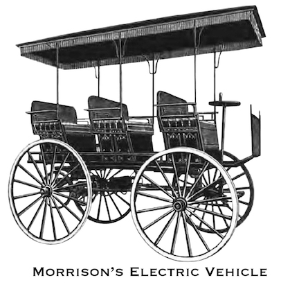 A picture of a three seat surrey - a four-wheeled carriage with three bench seats - adapted to be powered by electric batteries instead of by horses.