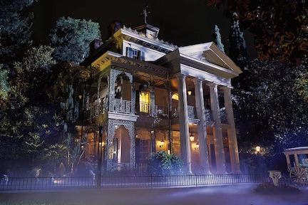 A picture of a haunted house attraction at night.